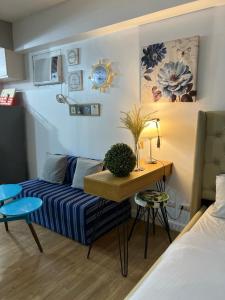 Postel nebo postele na pokoji v ubytování Abreeza Place Alveo