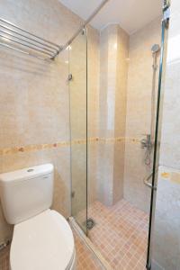 a bathroom with a toilet and a glass shower at Whole House with 3 Bedrooms in Hoan Kiem - 7mins to Hoan Kiem lake - FREE launchdry & breakfast in Hanoi +28 photos