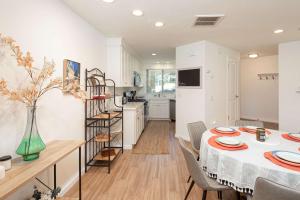 a kitchen and dining room with a table and chairs at Blacklake Resort Vacation Rental Nestled on the 9t in Los Berros