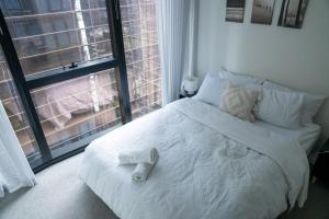 Ένα ή περισσότερα κρεβάτια σε δωμάτιο στο Home in the Sky 2BR,2BA with City Views,Pool & Gym +18 φωτογραφίες