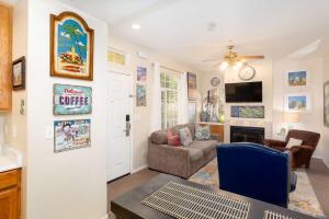 a living room with a couch and a chair at Tide & Treasures in Oceano