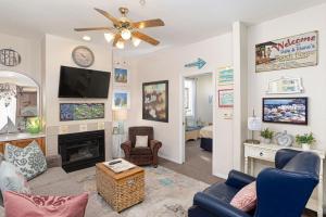 a living room with a couch and a fireplace at Tide & Treasures in Oceano