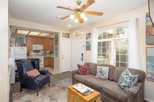 a living room with a couch and a ceiling fan at Tide & Treasures in Oceano +12 photos
