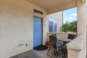 a door to a patio with a table and chairs at Eye Sea in Oceano