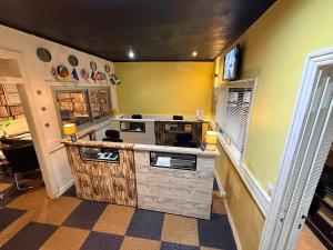 a kitchen with a counter with a stove top oven at Retreat Cameroon BASTOS in Yaoundé