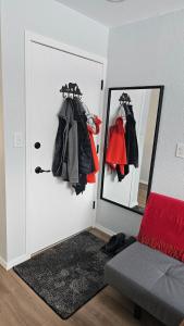 a room with a door with a mirror and clothes at Mt Spokane ski condo in Mead