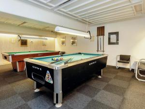 a billiard room with a pool table in it at 6 person holiday home on a holiday park in Faaborg in Fåborg +62 photos