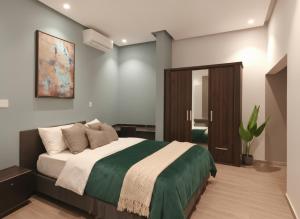 Postel nebo postele na pokoji v ubytování Roushan Resort