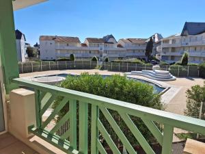 a balcony with a view of a pool and buildings at Studio cosy avec balcon, idéal pour 2 pers, Chatelaillon-Plage - FR-1-706-32 in Châtelaillon-Plage