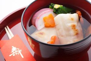 a red cup of soup with vegetables and carrots at SPRINGS VILLAGE Ashigara Tanzawa Onsen Resort & Gl - Vacation STAY 41907v in Hata