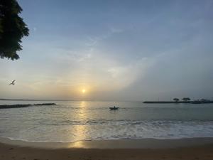 a person in a boat in the ocean at sunset at Seavora Tangalle in Tangalle