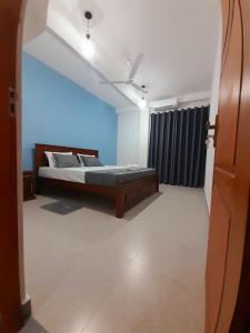 Postel nebo postele na pokoji v ubytování 10 BR Apartments - Galle City