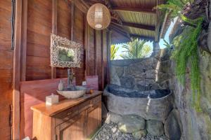 a bathroom with a bath tub and a sink at Gedong Batu Villas in Ubud +40 photos