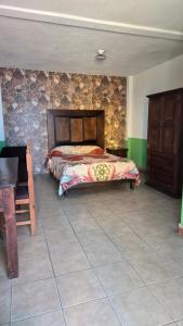 Postel nebo postele na pokoji v ubytování Hotel Los Remedios LUUM