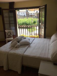 Postel nebo postele na pokoji v ubytování The Way Hotel Molinaseca