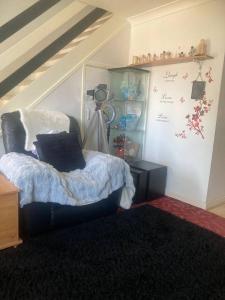 a bedroom with a bed and a wall with a shelf at Quaint and Peaceful - Calne in Calne +18 photos