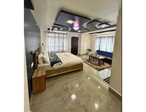 a bedroom with a bed and a table in it at Ana SonamTsomu, Tawang in Tawang +9 photos