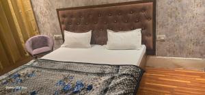 Postel nebo postele na pokoji v ubytování Hotel O Gangay