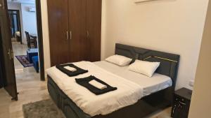 Postel nebo postele na pokoji v ubytování Mitron Homes