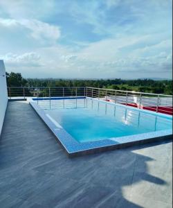 a large swimming pool on the roof of a building at Modern Smart Apartment with Easy Access in Mtwapa