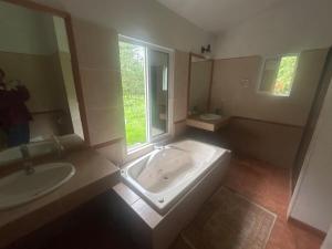 a large bathroom with a tub and a sink at Casa Nueva Holanda in Las Vigas