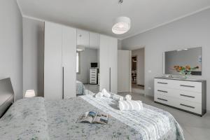 Ένα ή περισσότερα κρεβάτια σε δωμάτιο στο Casa Nadia - Happy Rentals
