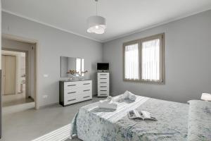 Ένα ή περισσότερα κρεβάτια σε δωμάτιο στο Casa Nadia - Happy Rentals