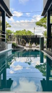a pool in a house with a fence at Arana Weligama in Weligama