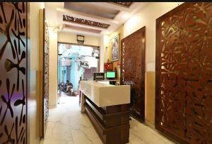 a lobby with a reception desk in a building at Hotel Prem Dx 2 Min Walk From New Delhi Railway Station in New Delhi