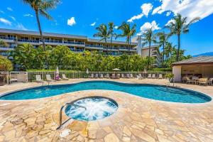 a swimming pool in front of a resort at Maui Banyan H207 · MB H207 Maui Escape Near Beach, Pool & Hot Tu in Kihei