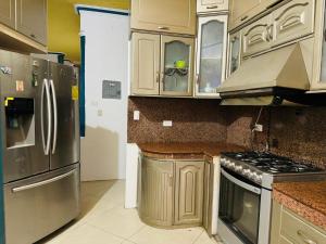 Kuchyň nebo kuchyňský kout v ubytování Casa Guadalupana - Manta