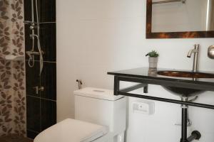 a bathroom with a toilet and a sink at Browny house - Doi Suthep View in Chiang Mai +94 photos