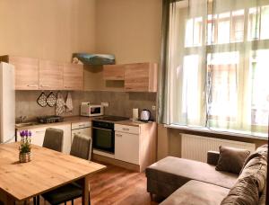 Kuchyň nebo kuchyňský kout v ubytování Oasis Valley + 47 fotografií