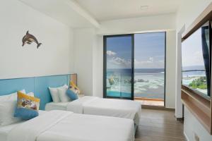 Postel nebo postele na pokoji v ubytování h78 Guraidhoo