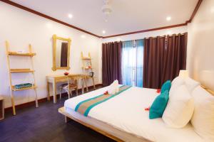 Postel nebo postele na pokoji v ubytování Pura Vida Cabilao Resort