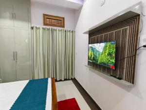 Μια τηλεόραση ή/και κέντρο ψυχαγωγίας στο Nidhipataye Homestay +47 φωτογραφίες