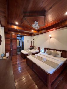 Ένα ή περισσότερα κρεβάτια σε δωμάτιο στο Chaluenxay Diamond Hotel