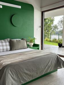 Ένα ή περισσότερα κρεβάτια σε δωμάτιο στο Emville - Villa in Cochin