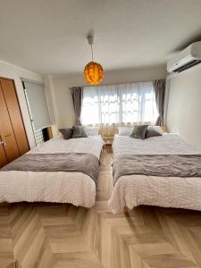 Ένα ή περισσότερα κρεβάτια σε δωμάτιο στο Nagoya west2