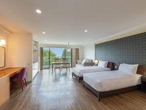 Ένα ή περισσότερα κρεβάτια σε δωμάτιο στο Izumigo AMBIENT Izu-Kogen Condominium