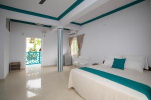 Ένα ή περισσότερα κρεβάτια σε δωμάτιο στο Appy Comfort Calangute Beach G0A