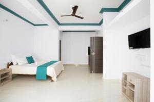 Μια τηλεόραση ή/και κέντρο ψυχαγωγίας στο Appy Comfort Calangute Beach G0A