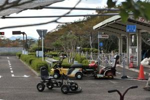 a group of scooters parked at a gas station at Hotel Sun tsuyama in Tuyama