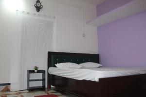 Ένα ή περισσότερα κρεβάτια σε δωμάτιο στο Morning Mist Home stay