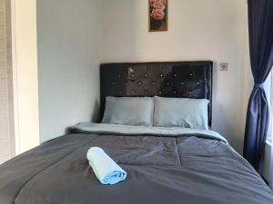 Ένα ή περισσότερα κρεβάτια σε δωμάτιο στο Pulmo Guesthouse Bromo