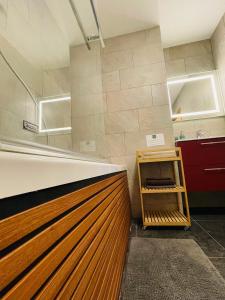a kitchen with a wooden counter top and a shelf at Le refuge de Montriond in Montriond