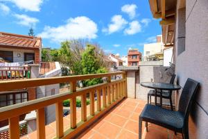a balcony with a table and chairs on a balcony at Penghu's peace in Magong