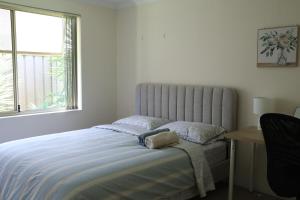 Ένα ή περισσότερα κρεβάτια σε δωμάτιο στο Sweet Home Property