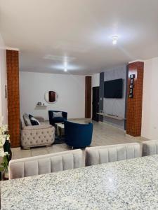 a living room with a couch and a table at LibiMar in Manta