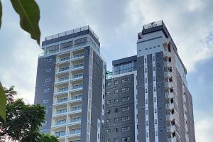 a tall gray building with a sky at Poulo Wai Hotel, Trademark Collection by Wyndham in Phnom Penh